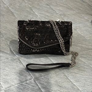 HOBO Daria black mini bag with laser cutouts.